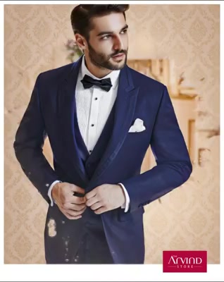 Give your cocktail party a creative touch. Flaunt your unique style by pairing this navy 3 piece cut & sew peak lapel suit with pleated tuxedo shirt and a bow tie. Book an appointment today -  http://bit.ly/TASBookAnAppointment
