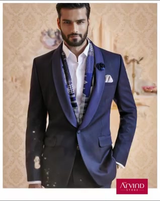 This navy blue textured shawl collar suit, paired with a white front pleated shirt ticks all the boxes when you aim to be the best-dressed guest at your colleague's reception. To know more, book an appointment - http://bit.ly/TASBookAnAppointment