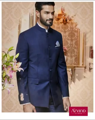Make your Sangeet ceremony extraordinary by pairing this navy blue bandhgala with a white cotton shirt. To know more, book an appointment - http://bit.ly/TASBookAnAppointment